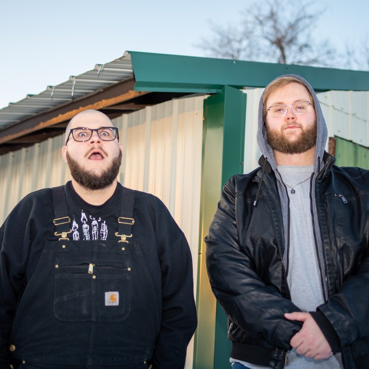 Kinda Mad - Keith and Colton standing outside a metal shed