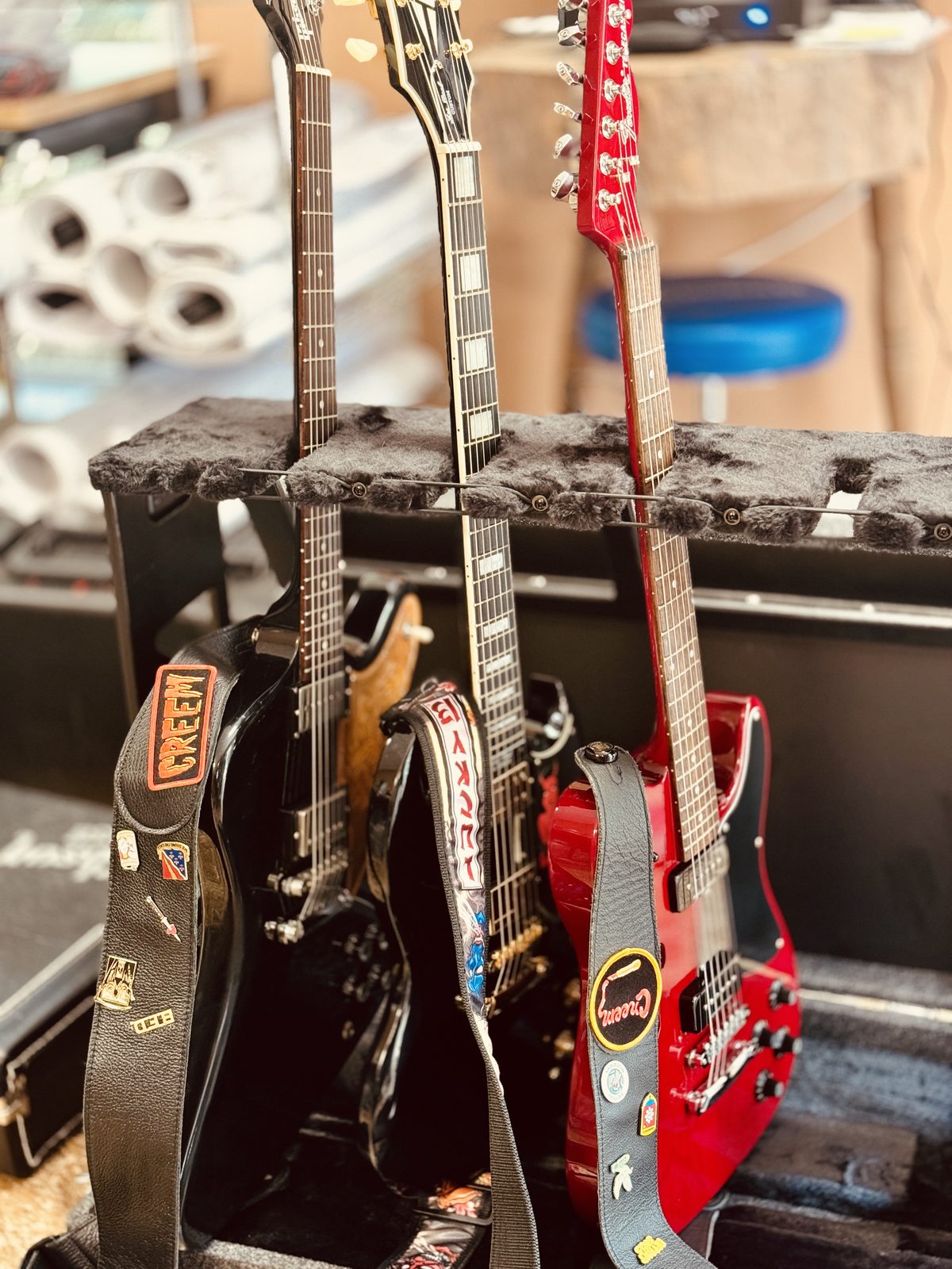 Guitars lined up on a rack